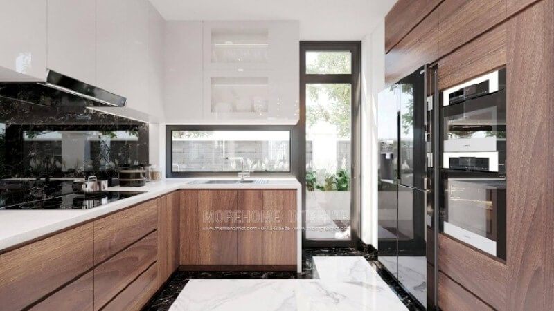 Nếu bạn đã được xem các mẫu tủ bếp hiện đại có tay nắm, thì có thể những mẫu tủ bếp đó đã lỗi thời, trang trí phòng bếp với toàn bộ bề mặt cánh tủ trơn nhẵn là một sự thay thế hoàn hảo, không chút tay cầm nhưng lại kéo đẩy dễ dàng nhờ ý tưởng thiết kế vát từ cánh tủ giúp bề mặt gọn gàng mà đẹp mắt.