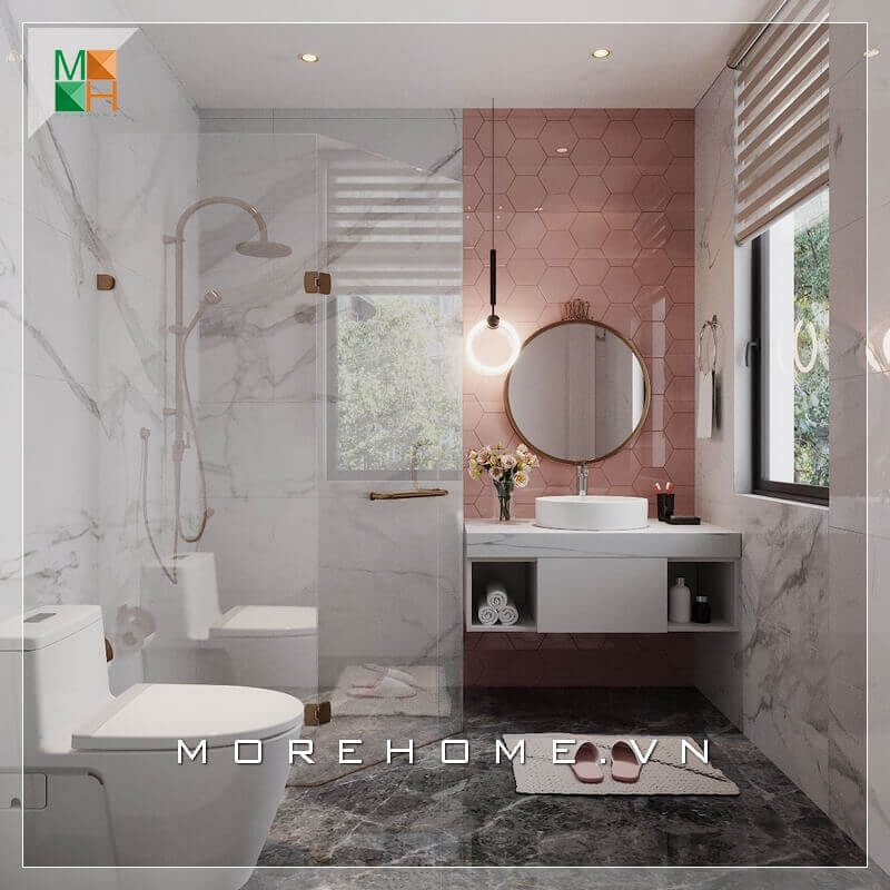 Mẫu thiết kế phòng tắm nhỏ đẹp phong cách hiện đại dành cho các căn hộ, nhà phố được nhấn mạnh bởi bức tường màu hồng ở khu vực lavabo, góp phần tạo nên nét trẻ trung và hiện đại cho không gian.